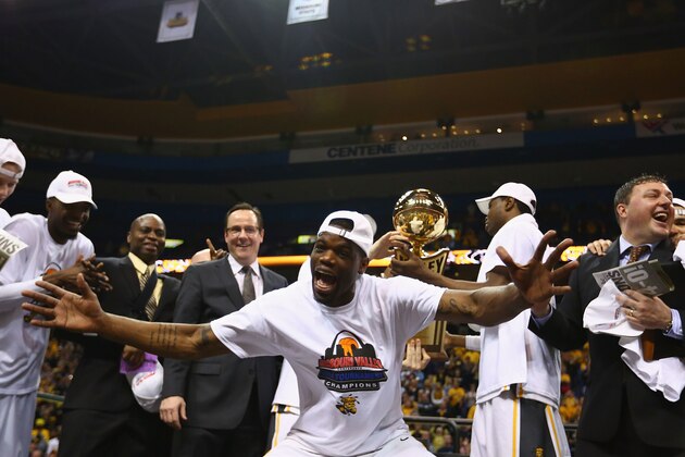 ST. LOUIS, MO - MARCH 9: Chadrack Lufile #0 of the Wichita State Shockers celebrates after beating the Indiana State Sycamores in the MVC Basketball Tournament Championship game at the Scottrade Center on March 9, 2014 in St. Louis, Missouri.  The Shockers beat the Sycamores 83-69.  (Photo by Dilip Vishwanat/Getty Images)