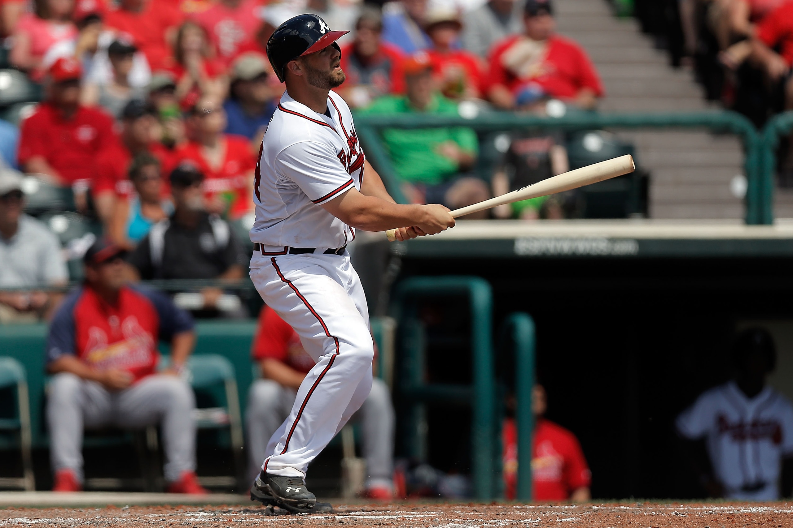 LAKE BUENA VISTA, FL - MARCH 15:  Evan Gattis #24 of the Atlanta Braves hits a fly ball in the fourth inning of a game against the St. Louis Cardinals at Champion Stadium on March 15, 2014 in Lake Buena Vista, Florida.  St. Louis won the game 6-2.  (Photo by Stacy Revere/Getty Images)