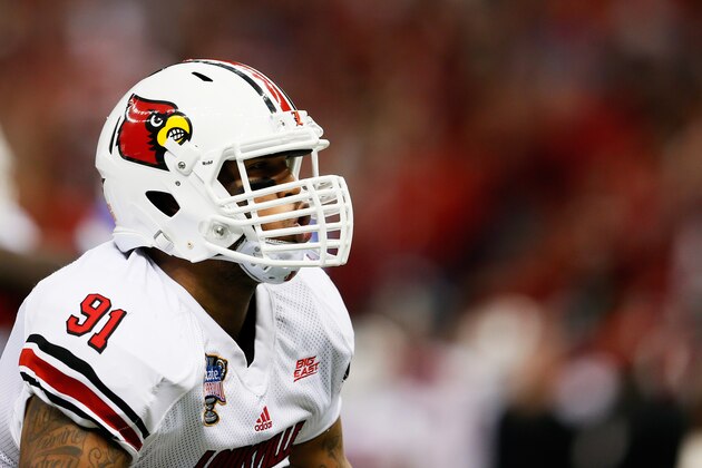 NEW ORLEANS, LA - JANUARY 02:  Marcus Smith #91 of the Louisville Cardinals celebrates sacking Jeff Driskel #6 of the Florida Gators in the second quarter of the Allstate Sugar Bowl at Mercedes-Benz Superdome on January 2, 2013 in New Orleans, Louisiana.  (Photo by Kevin C. Cox/Getty Images)