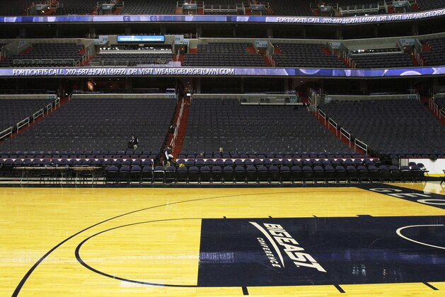 As the venue is cleaned, a Big East Conference logo is seen on the court after Georgetown played Western Carolina in an NCAA college basketball game at the Verizon Center in Washington, on Saturday, Dec. 15, 2012.  The seven Big East schools that don't play FBS football have decided to leave the conference and pursue a new basketball framework.  The seven schools are: Georgetown, St. John's, Villanova, DePaul, Marquette, Seton Hall and Providence. (AP Photo/Jacquelyn Martin)