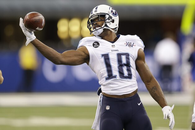 Tennessee Titans' Kenny Britt (18) warms up before an NFL football game against the Indianapolis Colts Sunday, Dec. 1, 2013, in Indianapolis. (AP Photo/Michael Conroy)