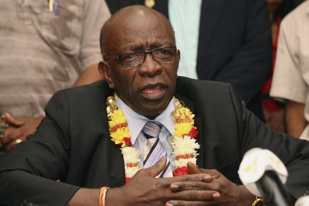 FILE - In this Thursday, June 2, 2011 file photo, suspended FIFA executive Jack Warner gestures during a news conference held shortly after his arrival at the airport in Port-of-Spain, in his native Trinidad and Tobago. Suspended FIFA Vice President Jack Warner has resigned from world football's governing body and had the corruption charges against him dropped. Warner was suspended by FIFA last month along with Asian football chief Mohamed bin Hammam over allegations of bribery during the presidential election. (AP Photo/Shirley Bahadur, File)
