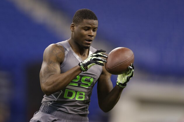 Wyoming defensive back Marqueston Huff runs a drill at the NFL football scouting combine in Indianapolis, Tuesday, Feb. 25, 2014. (AP Photo/Michael Conroy)