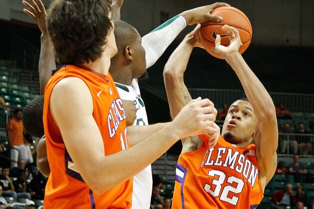 CORAL GABLES, FL - JANUARY 18:  K.J. McDaniels #32 of the Clemson Tigers has a shot blocked by Reggie Johnson #42 of the Miami (Fl) Hurricanes during a game  on January 18, 2012 in Coral Gables, Florida.  (Photo by Mike Ehrmann/Getty Images)