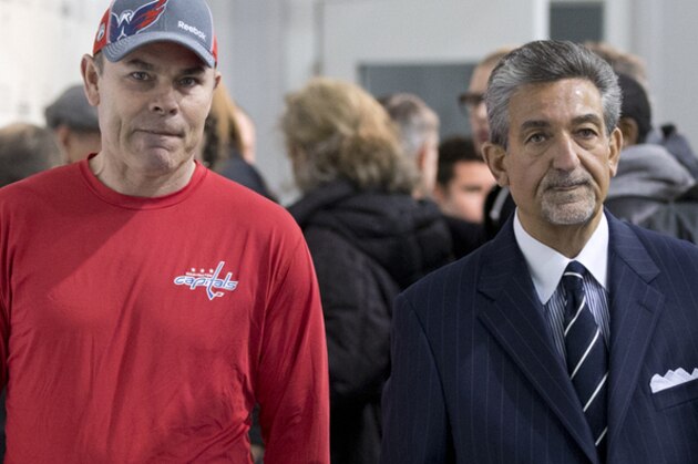 Washington Capitals owner Ted Leonsis, right, and coach Adam Oates leave a news conference Tuesday, Feb. 25, 2014, in Arlington, Va. (AP Photo/Carolyn Kaster)