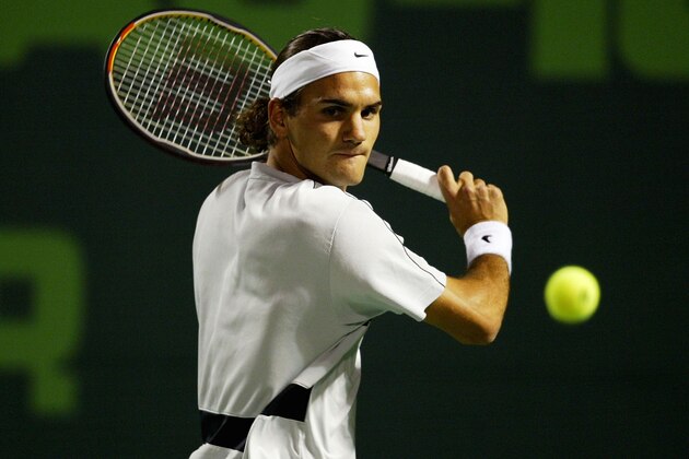 MIAMI - MARCH 28:  Roger Federer of Switzerland returns a shot against Rafael Nadal of Spain on March 28, 2004 during Nasdaq 100 Open  at the Crandon Park Tennis Center on Key Biscayne in Miami, Florida.  (Photo by Ezra Shaw/Getty Images)