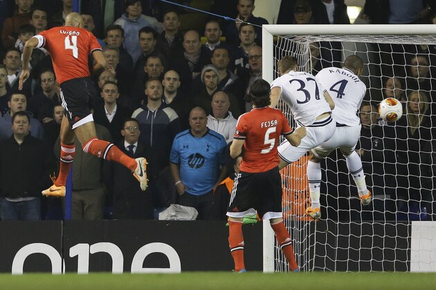 Benfica's Luisao, left, scores a goal during the Europa League round of 16 first leg soccer match between Tottenham Hotspur and SL Benfica at White Hart Lane stadium in London Thursday, March 13, 2014. (AP Photo/Kirsty Wigglesworth)