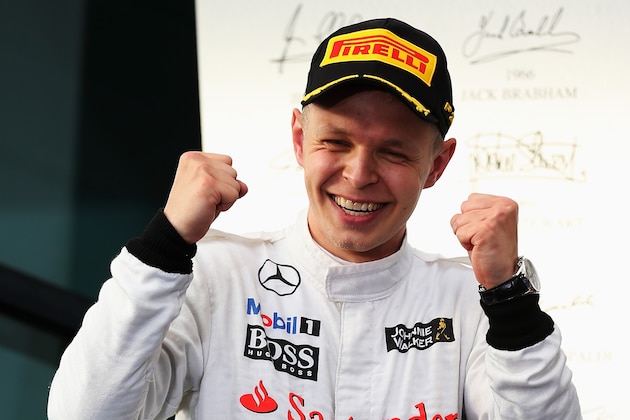 MELBOURNE, AUSTRALIA - MARCH 16:  Kevin Magnussen of Denmark and McLaren celebrates on the podium after finishing third during the Australian Formula One Grand Prix at Albert Park on March 16, 2014 in Melbourne, Australia.  (Photo by Mark Thompson/Getty Images)