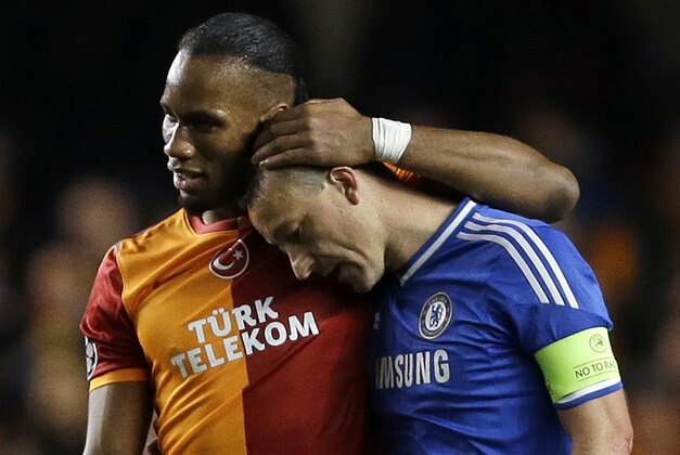 Galatasaray's Didier Drogba, left, embraces Chelsea's John Terry at the end of the Champions League round of 16 second leg soccer match between Chelsea and Galatasaray at Stamford Bridge stadium in London Tuesday, March 18, 2014. (AP Photo/Kirsty Wigglesworth) Galatasaray's Didier Drogba, left, embraces Chelsea's John Terry at the end of the Champions League round of 16 second leg soccer match between Chelsea and Galatasaray at Stamford Bridge stadium in London Tuesday, March 18, 2014. (AP Photo/Kirsty Wigglesworth)