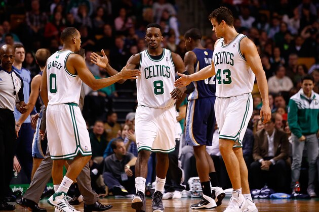 BOSTON, MA - NOVEMBER 27: Avery Bradley #0, Jeff Green #8, and Kris Humphries #43 of the Boston Celtics congratulate each other in the first quarter against the Memphis Grizzlies during the game at TD Garden on November 27, 2013 in Boston, Massachusetts.  NOTE TO USER: User expressly acknowledges and agrees that, by downloading and or using this photograph, User is consenting to the terms and conditions of the Getty Images License Agreement. (Photo by Jared Wickerham/Getty Images)