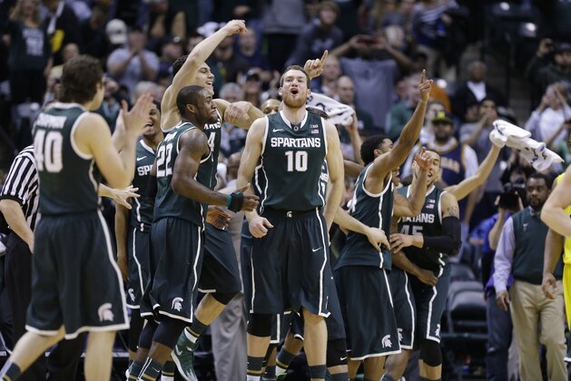 Players on Michigan State bench celebrate in the second half of an NCAA college basketball game against Michigan in the championship of the Big Ten Conference tournament Sunday, March 16, 2014, in Indianapolis. Michigan State won 69-55. (AP Photo/Michael Conroy) Players on Michigan State bench celebrate in the second half of an NCAA college basketball game against Michigan in the championship of the Big Ten Conference tournament Sunday, March 16, 2014, in Indianapolis. Michigan State won 69-55. (AP Photo/Michael Conroy)