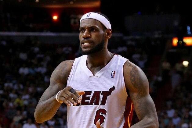 MIAMI, FL - MARCH 12:  LeBron James #6 of the Miami Heat reacts to a play during a game against the Brooklyn Nets at American Airlines Arena on March 12, 2014 in Miami, Florida. NOTE TO USER: User expressly acknowledges and agrees that, by downloading and/or using this photograph, user is consenting to the terms and conditions of the Getty Images License Agreement. Mandatory copyright notice:  (Photo by Mike Ehrmann/Getty Images)