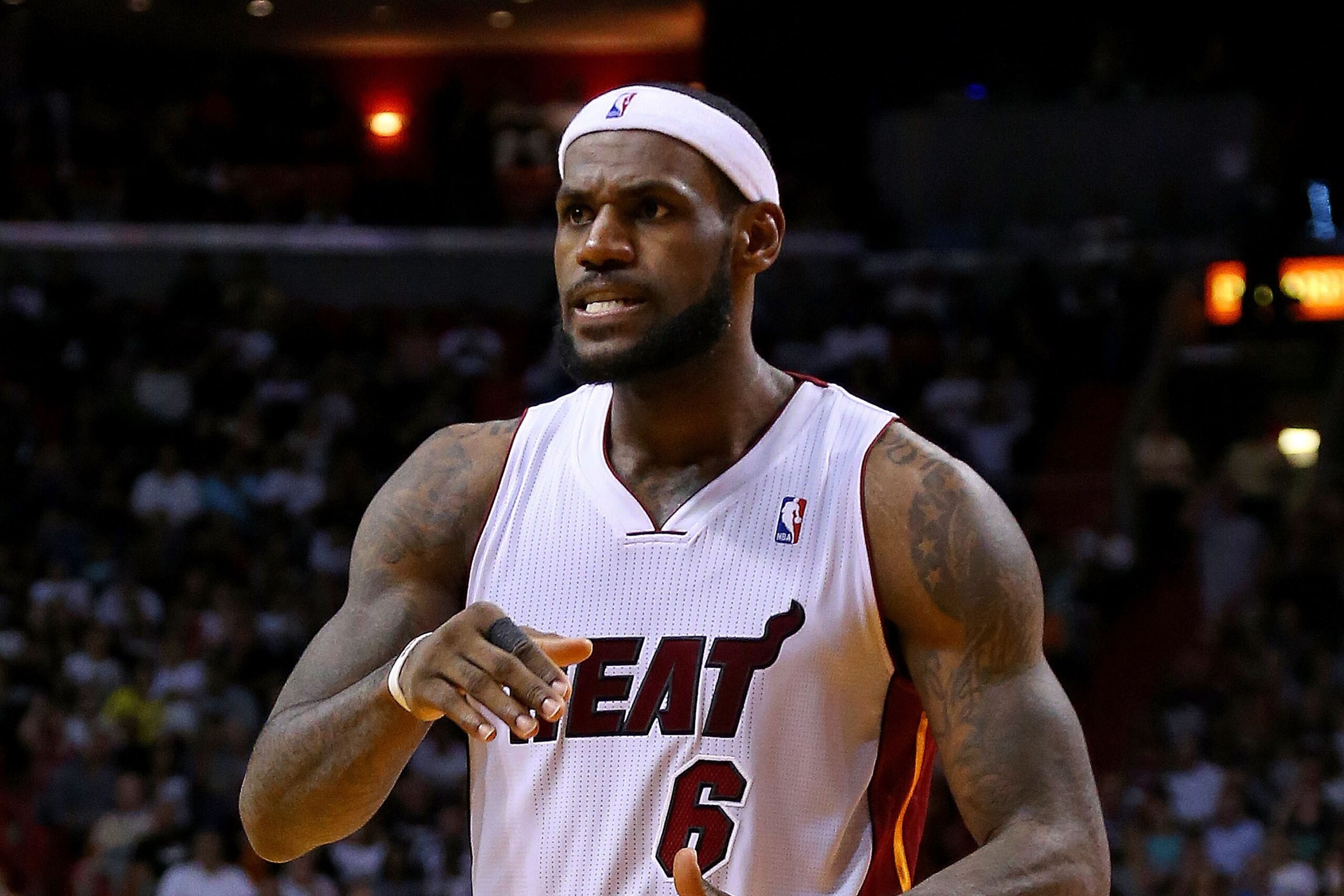 MIAMI, FL - MARCH 12:  LeBron James #6 of the Miami Heat reacts to a play during a game against the Brooklyn Nets at American Airlines Arena on March 12, 2014 in Miami, Florida. NOTE TO USER: User expressly acknowledges and agrees that, by downloading and/or using this photograph, user is consenting to the terms and conditions of the Getty Images License Agreement. Mandatory copyright notice:  (Photo by Mike Ehrmann/Getty Images)