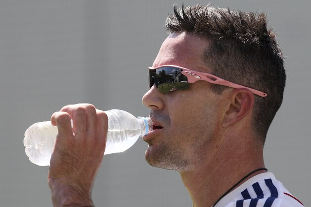 England's Kevin Pietersen has a drink during the final training session on the eve of the first test in the Ashes Series between England and Australia,  in Brisbane, Australia, Wednesday, Nov. 20, 2013. (AP Photo/Tertius Pickard)