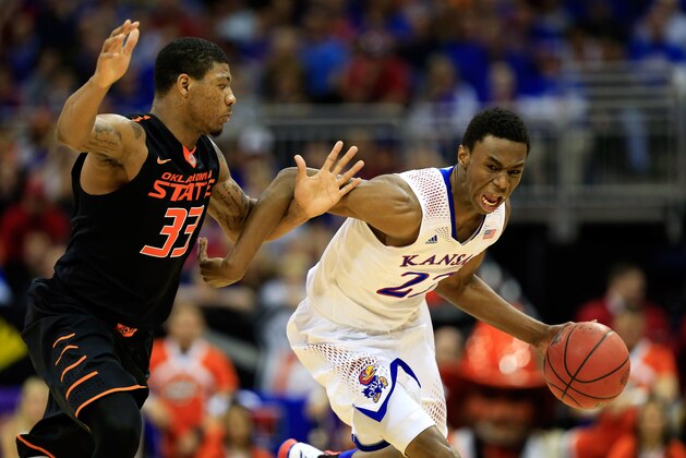 KANSAS CITY, MO - MARCH 13:  Andrew Wiggins #22 of the Kansas Jayhawks drives upcourt as Marcus Smart #33 of the Oklahoma State Cowboys defends during the Big 12 Basketball Tournament quarterfinal game at Sprint Center on March 13, 2014 in Kansas City, Missouri.  (Photo by Jamie Squire/Getty Images)