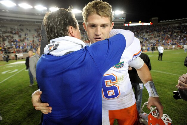 Nov 24, 2012; Tallahassee, FL, USA; Florida Gators quarterback Jeff Driskel (6) hugs head coach Will Muschamp following a victory over Florida State Seminoles at Doak Campbell Stadium. Mandatory Credit: Kevin Liles-USA TODAY Sports