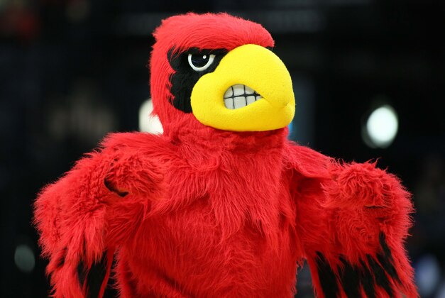 Mar 15, 2014; Memphis, TN, USA; Louisville Cardinals mascot performs during a timeout in the second half against the Connecticut Huskies in final of the American Athletic Conference college basketball tournament at FedEx Forum. Louisville defeated Connecticut 71-61. Mandatory Credit: Nelson Chenault-USA TODAY Sports