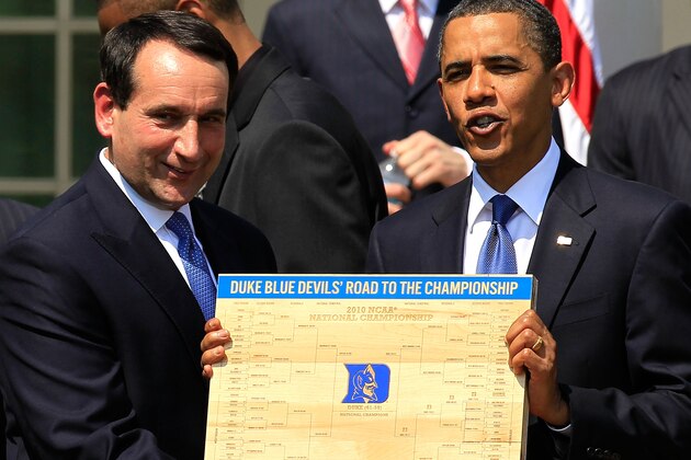 WASHINGTON - MAY 27:  U.S. President Barack Obama (R) is presented with a plaque of a bracket by coach Mike Krzyzewski (L) of the Duke Blue Devils during a Rose Garden event May 27, 2010 at the White House in Washington, DC. Obama hosted the NCAA men basketball champions to honor their 2009-2010 season.  (Photo by Alex Wong/Getty Images)