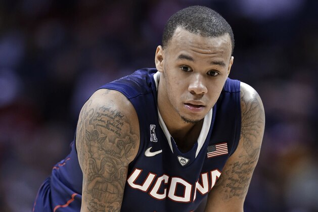 Connecticut guard Shabazz Napier waits for a player to shoot a free throw during the second half of an NCAA college basketball game in the finals of the American Athletic Conference men's tournament Saturday, March 15, 2014, in Memphis, Tenn. Napier scored 16 points. Louisville won 71-61. (AP Photo/Mark Humphrey)