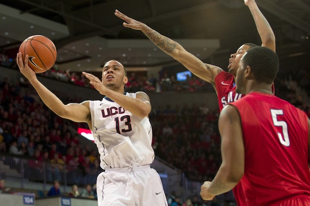DALLAS, TX - JANUARY 4: Shabazz Napier #13 of the Connecticut Huskies drives to the basket against the SMU Mustangs on January 4, 2014 at Moody Coliseum in Dallas, Texas.  (Photo by Cooper Neill/Getty Images)