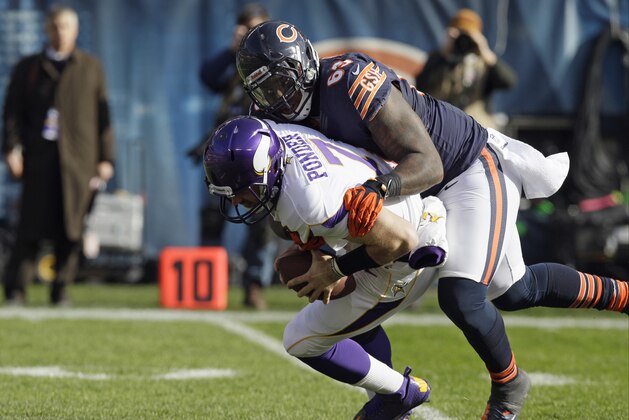 Chicago Bears defensive tackle Henry Melton (69) sacks Minnesota Vikings quarterback Christian Ponder (7) in the first half of an NFL football game in Chicago, Sunday, Nov. 25, 2012. (AP Photo/Nam Y. Huh)