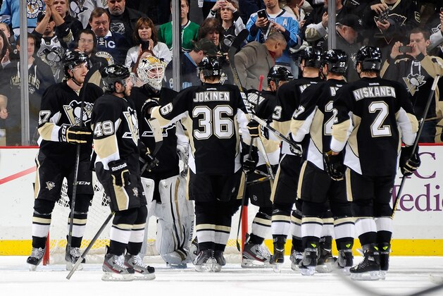 PITTSBURGH, PA - MARCH 18:  Jeff Zatkoff #37 of the Pittsburgh Penguins is congratulated by teammates after a 5-1 win over the Dallas Stars on March 18, 2014 at Consol Energy Center in Pittsburgh, Pennsylvania.  (Photo by Joe Sargent/NHLI via Getty Images)