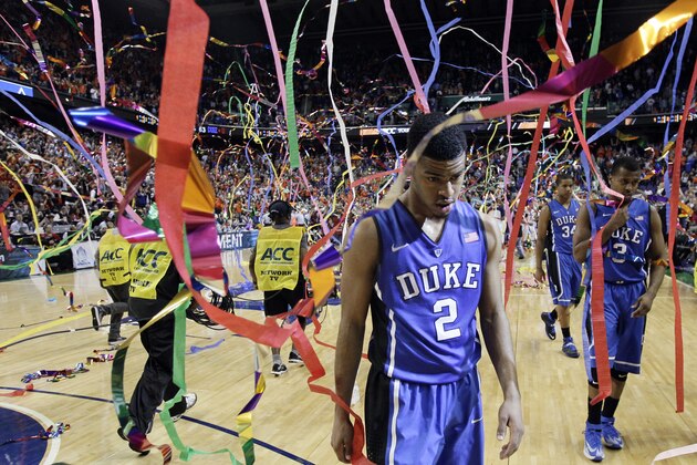 Duke's Quinn Cook (2) walks off the court after losing to Virginia in an NCAA college basketball game in the championship for the Atlantic Coast Conference tournament in Greensboro, N.C., Sunday, March 16, 2014. Virginia won 72-63. (AP Photo/Gerry Broome)