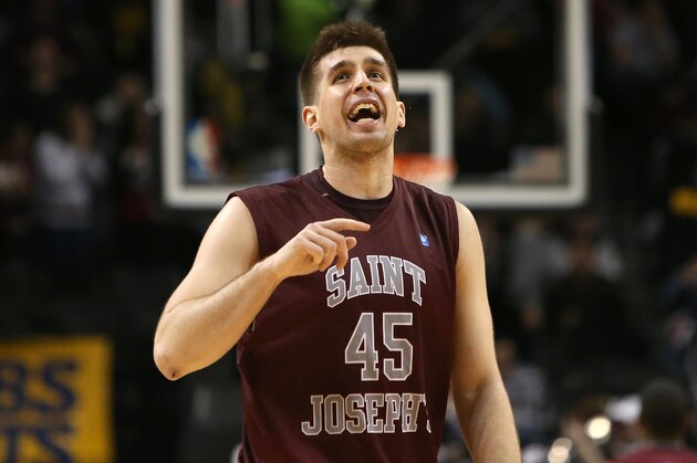 NEW YORK, NY - MARCH 16:  Halil Kanacevic #45 of the Saint Joseph's Hawks celebrates late in the game against the Virginia Commonwealth Rams during the Championship game of the 2014 Atlantic 10 Men's Basketball Tournament at Barclays Center on March 16, 2014 in the Brooklyn borough of New York City.  (Photo by Mike Lawrie/Getty Images)