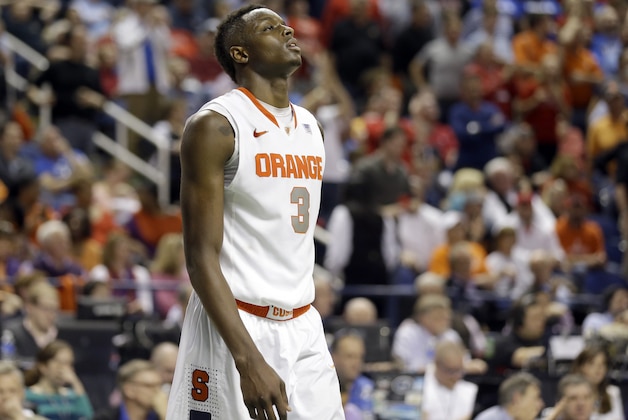 Syracuse's Jerami Grant (3) walks off the court after their loss to North Carolina State in a quarterfinal NCAA college basketball game at the Atlantic Coast Conference tournament in Greensboro, N.C., Friday, March 14, 2014. North Carolina State won 66-63. (AP Photo/Gerry Broome)
