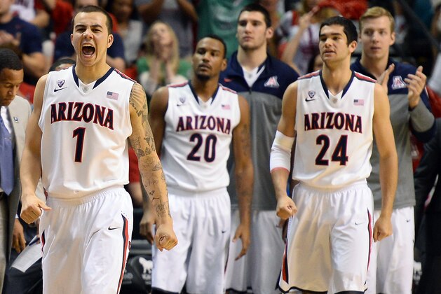 LAS VEGAS, NV - MARCH 15:  Gabe York #1 of the Arizona Wildcats reacts as teammates Jordin Mayes #20 and Elliott Pitts #24 look on during a timeout in the championship game of the Pac-12 Basketball Tournament against the UCLA Bruins at the MGM Grand Garden Arena on March 15, 2014 in Las Vegas, Nevada. UCLA won 75-71.  (Photo by Ethan Miller/Getty Images)