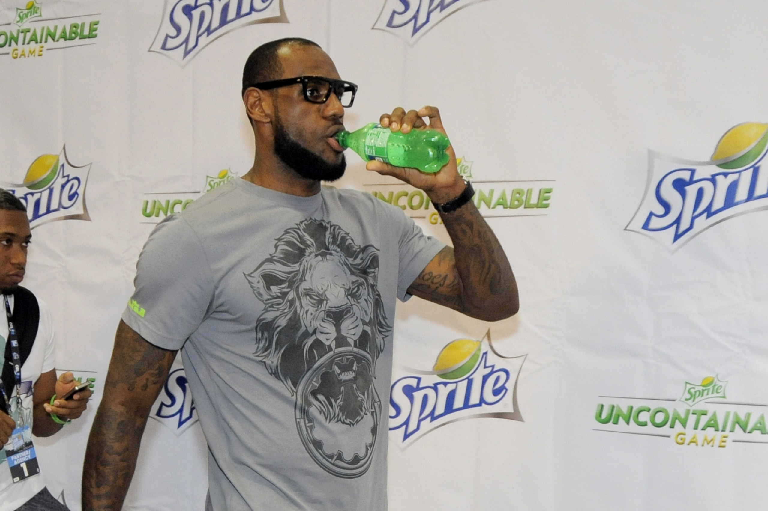 Miami Heat's LeBron James drinks a Sprite after he talked to the media for the launch the Sprite Uncontainable Game during NBA All-Star 2012 on Feb. 24, 2012, in Orlando. They are leading a global search for 24 amateur ballers to represent Team Sudden and Team Intense in the Sprite Uncontainable Game (TM) at NBA All-Star 2013 in Houston. (Jack Dempsey /AP Images for Sprite)
