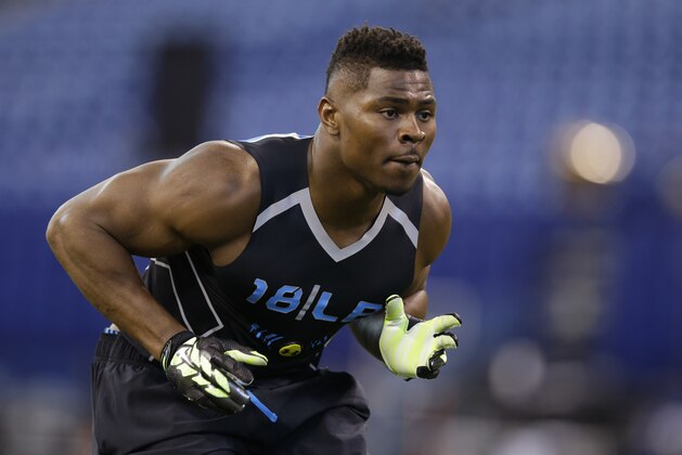 Buffalo linebacker Khalil Mack runs a drill at the NFL football scouting combine in Indianapolis, Monday, Feb. 24, 2014. (AP Photo/Michael Conroy)