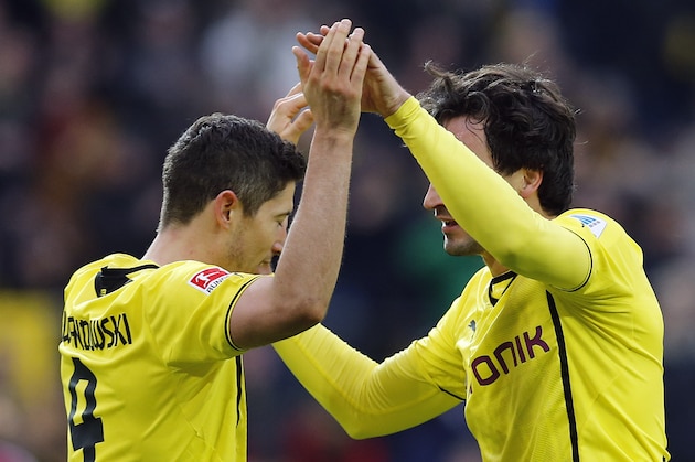 Dortmund's Robert Lewandowski of Poland, left,  and Dortmund's Mats Hummels celebrate after scoring  during the German first division Bundesliga soccer match between BvB Borussia Dortmund and 1.FC Nuremberg in Dortmund, Germany, Saturday, March 1, 2014. (AP Photo/Frank Augstein)