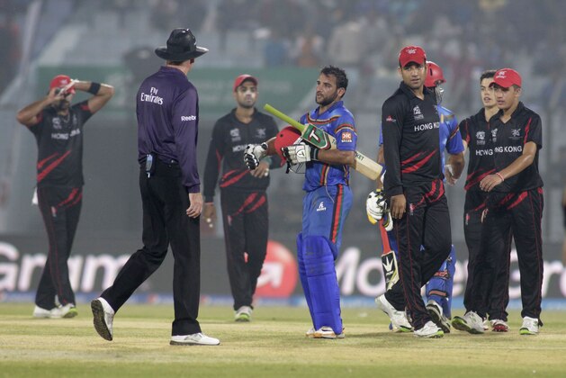 Afghan batsmen, blue uniform, greet Hong Kong players after they won their ICC Twenty20 Cricket World Cup match in Chittagong, Bangladesh, Tuesday, March 18, 2014. Afghanistan won by seven wickets. (AP Photo/Bikas Das) Afghan batsmen, blue uniform, greet Hong Kong players after they won their ICC Twenty20 Cricket World Cup match in Chittagong, Bangladesh, Tuesday, March 18, 2014. Afghanistan won by seven wickets. (AP Photo/Bikas Das)