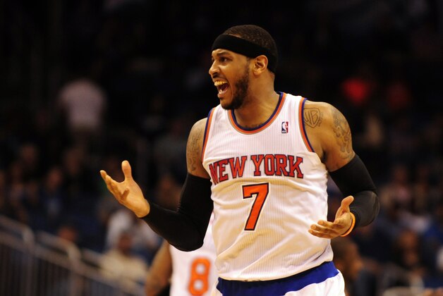 Feb 21, 2014; Orlando, FL, USA; New York Knicks small forward Carmelo Anthony (7) celebrates after hitting a three-point-basket in the second half as the Orlando Magic beat the New York Knicks 129-121 in double overtime at Amway Center. Anthony had a game-high 44 points. Mandatory Credit: David Manning-USA TODAY Sports