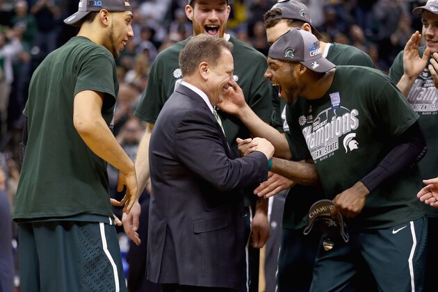 INDIANAPOLIS, IN - MARCH 16:  Tom Izzo and Branden Dawson #22 of the Michigan State Spartans celebrates after the 69-55 win over the Michigan Wolverines  during the finals of the Big Ten Basketball Tournament at Bankers Life Fieldhouse on March 16, 2014 in Indianapolis, Indiana.  (Photo by Andy Lyons/Getty Images)