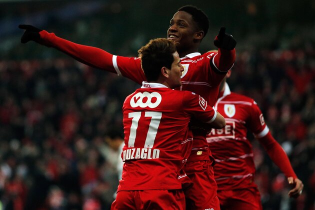 LIEGE, BELGIUM - JANUARY 25:  Michy Batshuayi of Standard is congratulated by team mate Maor Buzaglo after he scores a goal during the Jupiler League match between Standard de Liege and KV Kortrijk at Stade Maurice Dufrasne the on January 25, 2013 in Liege, Belgium.  (Photo by Dean Mouhtaropoulos/Getty Images)