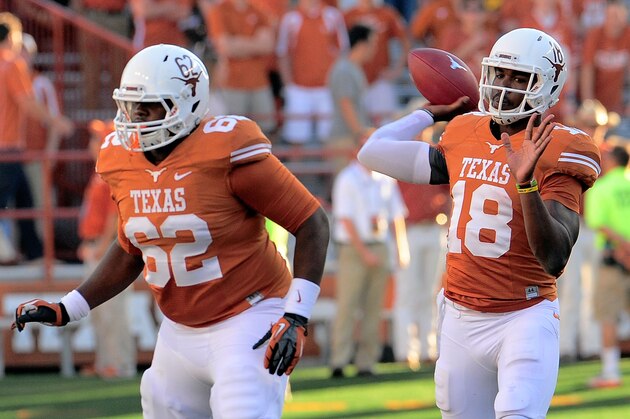 AUSTIN, TX - NOVEMBER 02:  Tyrone Swoopes #18 of the Texas Longhorns drops back to pass against the Kansas Jayhawks during a game at Darrell K Royal-Texas Memorial Stadium on November 2, 2013 in Austin, Texas.  Texas won the game 35-13. (Photo by Stacy Revere/Getty Images)