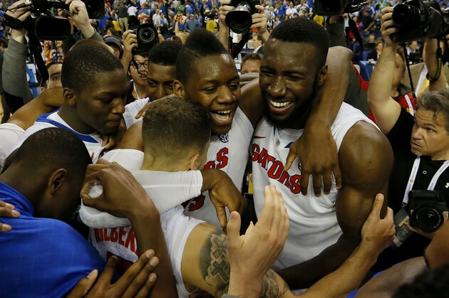 ATLANTA, GA - MARCH 16:  Scottie Wilbekin #5, Will Yeguete #15 and Patric Young #4 of the Florida Gators celebrate their 61 to 60 win over the Kentucky Wildcats in the Championship game of the 2014 Men's SEC Basketball Tournament at Georgia Dome on March 16, 2014 in Atlanta, Georgia.  (Photo by Kevin C. Cox/Getty Images)