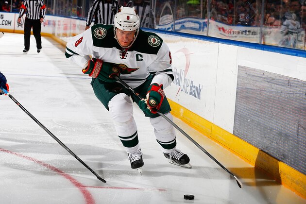 UNIONDALE, NY - MARCH 18:  Mikko Koivu #9 of the Minnesota Wild skates against the New York Islanders at Nassau Veterans Memorial Coliseum on March 18, 2014 in Uniondale, New York.  Wild defeated the Islanders 6-0.  (Photo by Mike Stobe/NHLI via Getty Images)