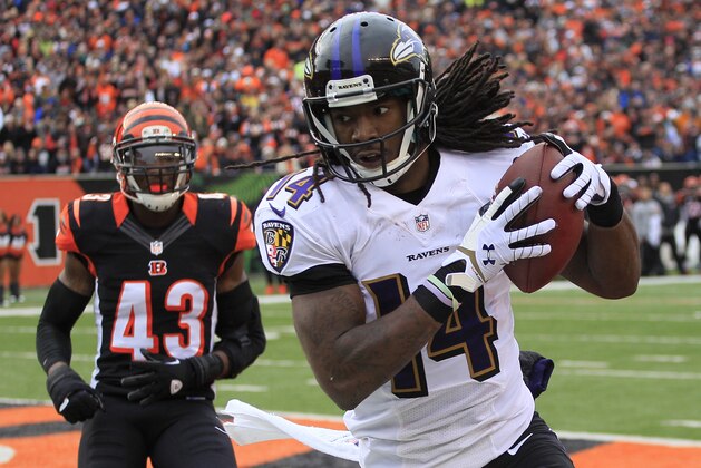 Baltimore Ravens wide receiver Marlon Brown (14) catches an 8-yard touchdown pass against Cincinnati Bengals strong safety George Iloka (43) in the second half of an NFL football game on Sunday, Dec. 29, 2013, in Cincinnati. (AP Photo/Tom Uhlman)