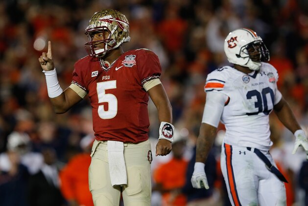 PASADENA, CA - JANUARY 06:  Quarterback Jameis Winston #5 of the Florida State Seminoles signals during the 2014 Vizio BCS National Championship Game against the Auburn Tigers at the Rose Bowl on January 6, 2014 in Pasadena, California.  (Photo by Kevin C. Cox/Getty Images)
