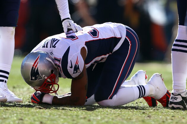 DENVER, CO - JANUARY 19:   Aqib Talib #31 of the New England Patriots kneels over on the ground after colliding with Wes Welker #83 of the Denver Broncos during the AFC Championship game at Sports Authority Field at Mile High on January 19, 2014 in Denver, Colorado.  (Photo by Doug Pensinger/Getty Images)