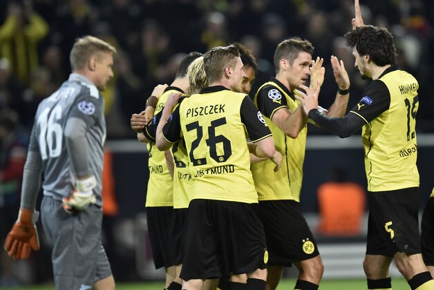 Dortmund's Sebastian Kehl, second right, celebrates scoring his side's first goal with his teammates during the UEFA Champions League last 16 second leg soccer match between Borussia Dortmund and FC Zenit in Dortmund, Germany, Wednesday, March 19, 2014.  (AP Photo/Martin Meissner)