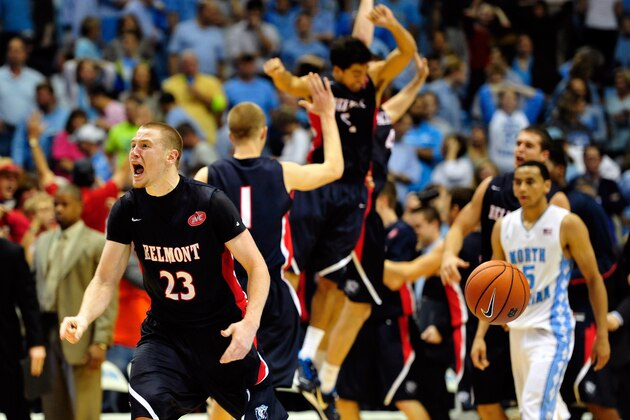 CHAPEL HILL, NC - NOVEMBER 17:  Craig Bradshaw #23 of the Belmont Bruins and teammates celebrate after a win as Marcus Paige #5 of the North Carolina Tar Heels walks off the court at the Dean Smith Center on November 17, 2013 in Chapel Hill, North Carolina. Belmont defeated North Carolina 83-80.  (Photo by Grant Halverson/Getty Images)