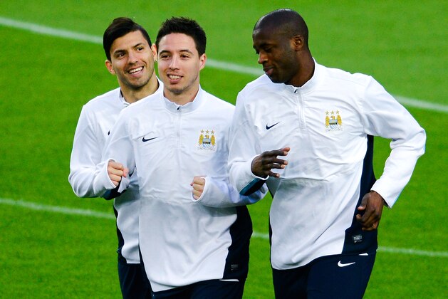 BARCELONA, SPAIN - MARCH 11:  (L-R) Manchester City FC players Sergio Aguero, Samir Nasri and Yaya Toure warm up during a training session ahead the UEFA Champions League Round of 16 second leg match against FC Barcelona at Camp Nou on March 11, 2014 in Barcelona, Spain.  (Photo by David Ramos/Getty Images)