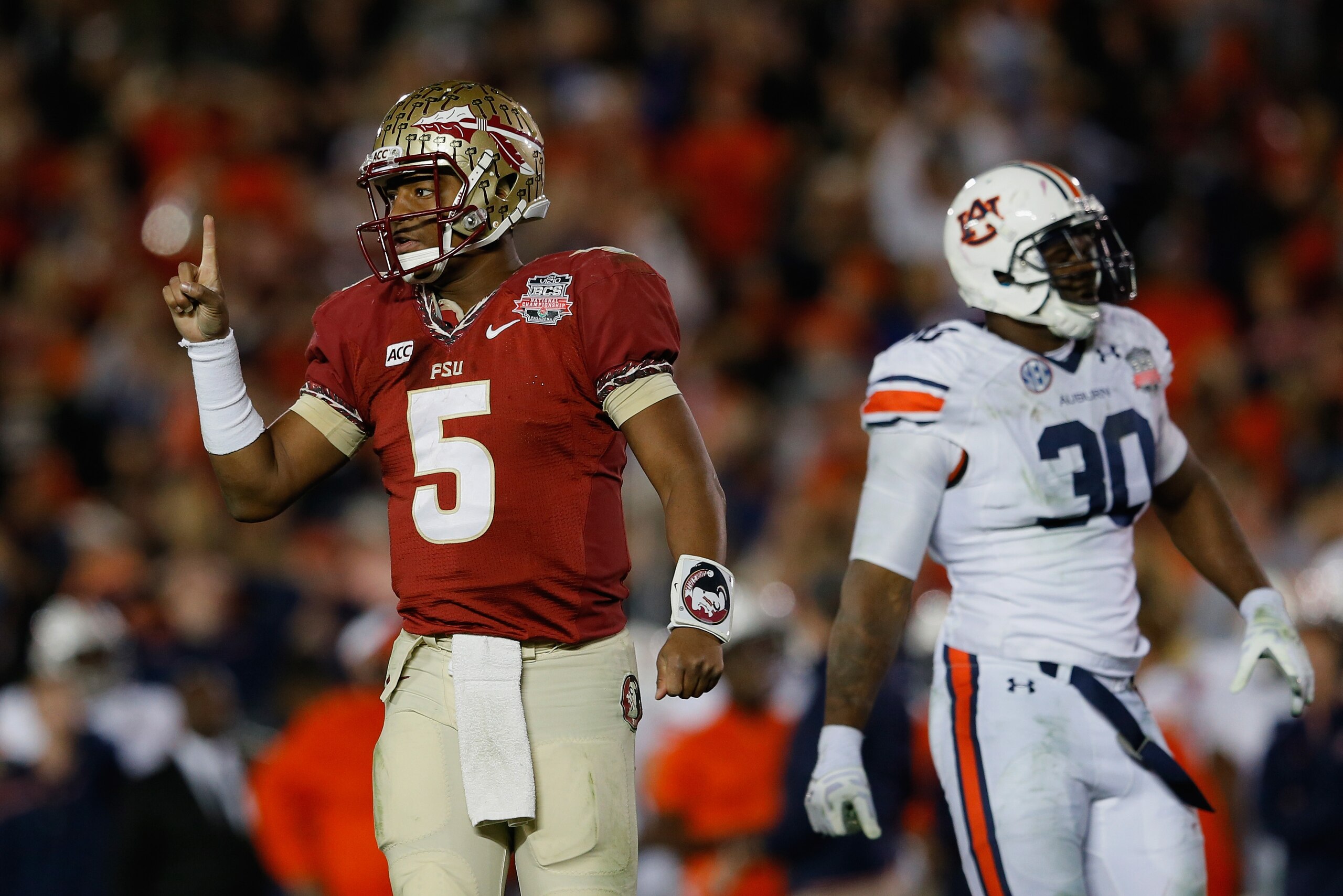 PASADENA, CA - JANUARY 06:  Quarterback Jameis Winston #5 of the Florida State Seminoles signals during the 2014 Vizio BCS National Championship Game against the Auburn Tigers at the Rose Bowl on January 6, 2014 in Pasadena, California.  (Photo by Kevin C. Cox/Getty Images)