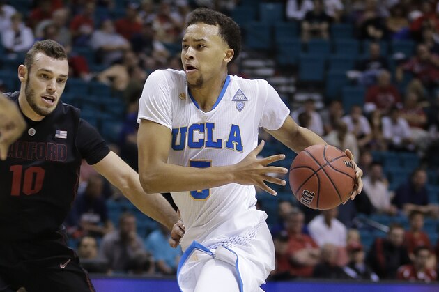 UCLA's Kyle Anderson (5) drives against Stanford's Robbie Lemons in the second half during the semifinals of the NCAA Pac-12 conference college basketball tournament, Friday, March 14, 2014, in Las Vegas. (AP Photo/Julie Jacobson)