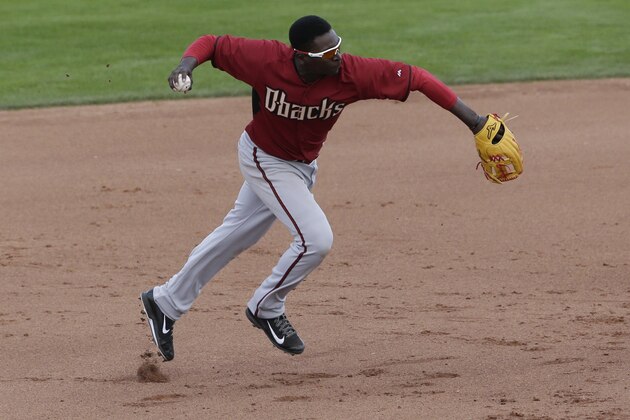 Arizona Diamondbacks shortstop Didi Gregorius  throws out San Francisco Giants' Hunter Pence at first during the fifth inning of a spring training baseball game Sunday, March 2, 2014, in Scottsdale, Ariz. (AP Photo/Gregory Bull)