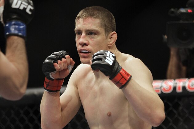 Duane Ludwig, right, fights Josh Neer in a welterweight UFC mixed martial arts fight on Friday, Jan. 20, 2012, in Nashville, Tenn. (AP Photo/Mark Humphrey)